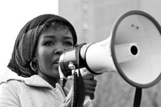 photo of a woman speaking at a rally